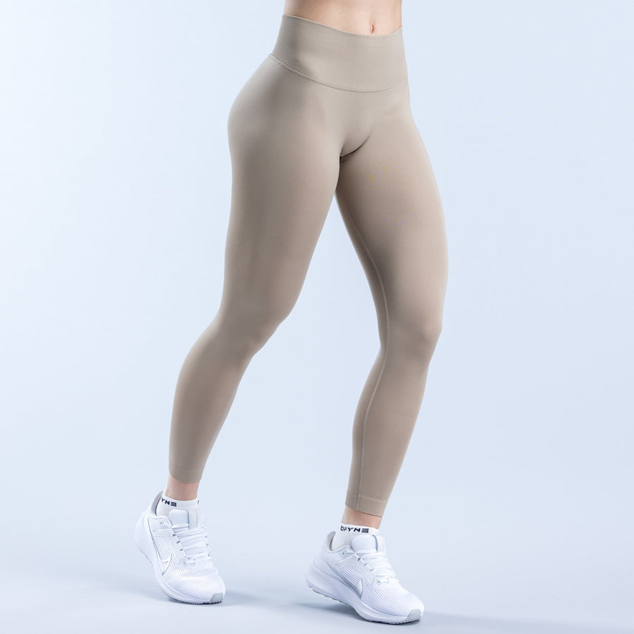 Beige high-rise leggings, full-length with smooth waistband and leg contour seam