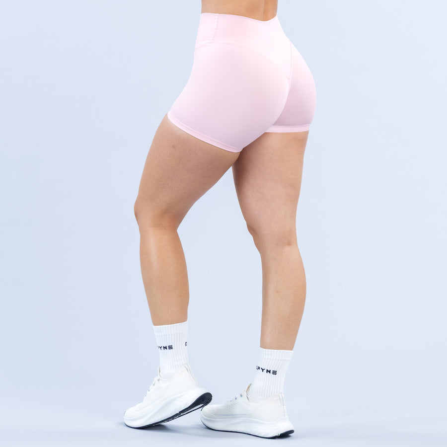Pink 4.5-inch athletic shorts, back/side view with smooth stretch fabric