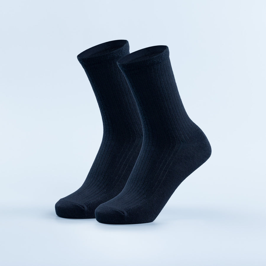 Pair of dark navy crew socks with ribbed knit texture