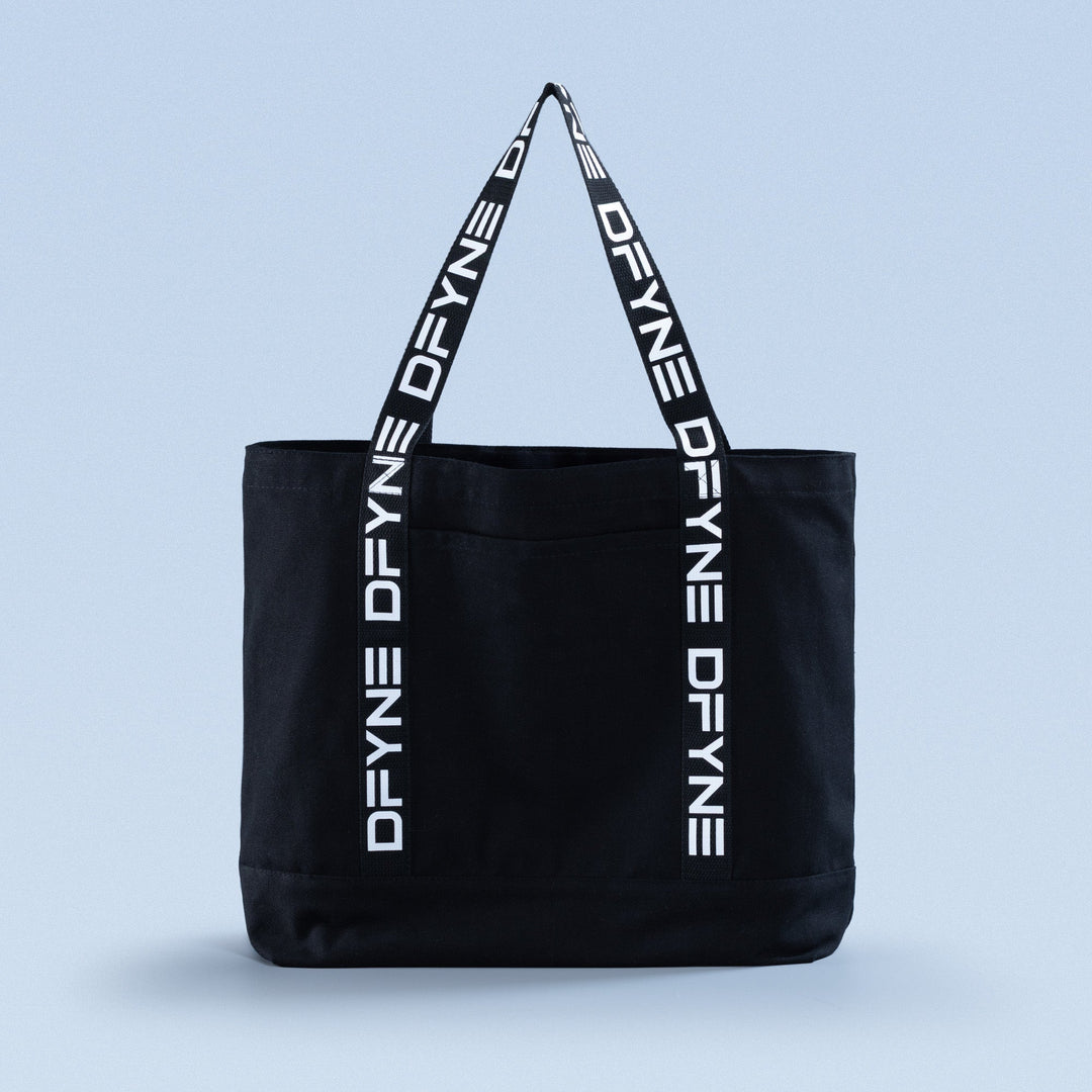 Black tote bag with top handles and vertical logo print straps