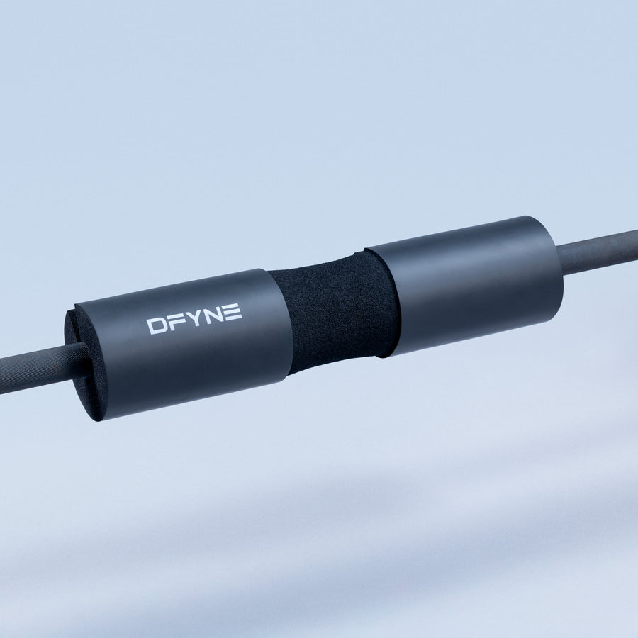 DFYNE black foam barbell pad with textured sleeve on metal bar