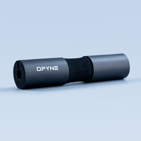 Black barbell pad with DFYNE logo, foam core and cylindrical sleeve