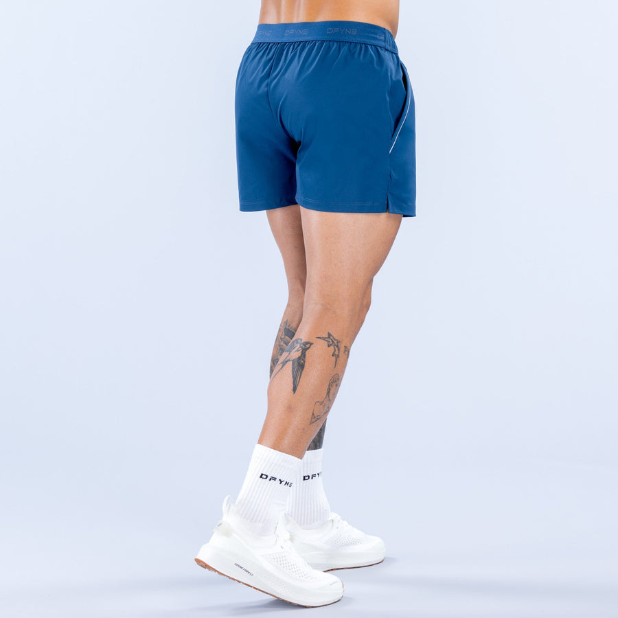 Men's blue training shorts with elastic waistband and small side logo