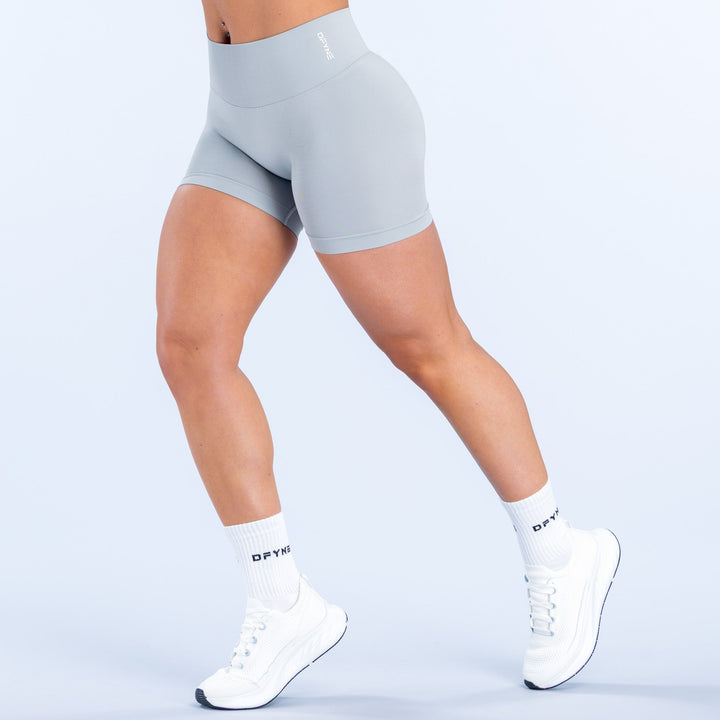 Defy 4.5in shorts, light blue high-rise biker fit, side view