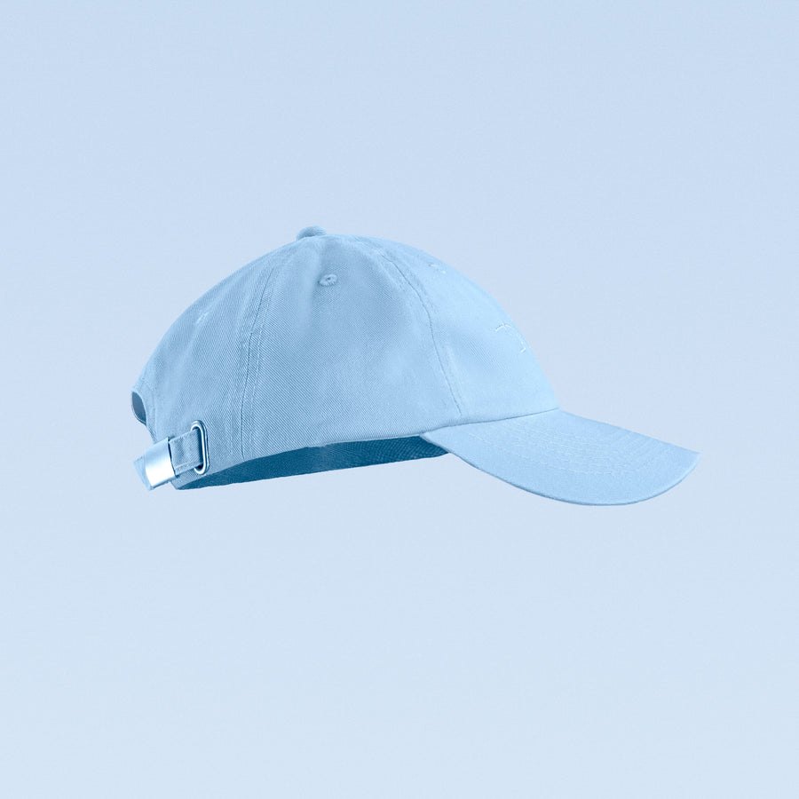 Light blue baseball cap with script logo, side buckle strap, and curved brim