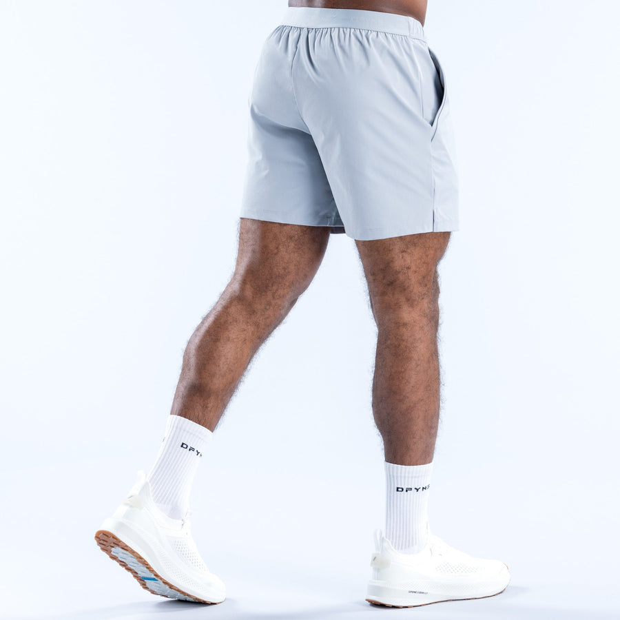 Light blue athletic training shorts, back view with stitched panel details