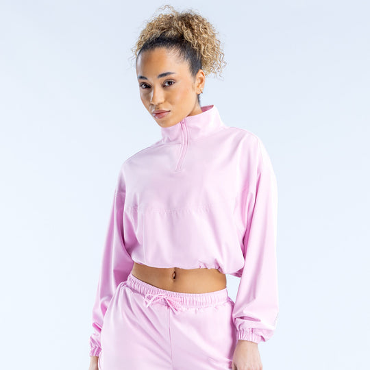 Pink cropped zip jacket with high neck and long sleeves, elastic cuffs and hem