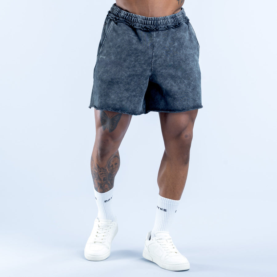 Washed navy-blue denim shorts with elastic waistband and curved side pockets