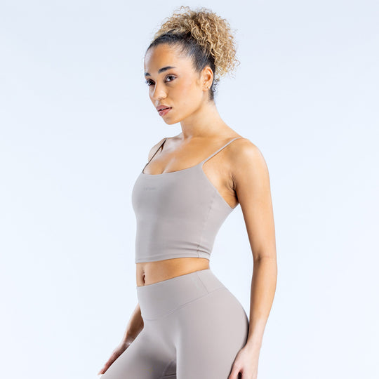 Gray strappy cropped tank top with thin straps and fitted silhouette