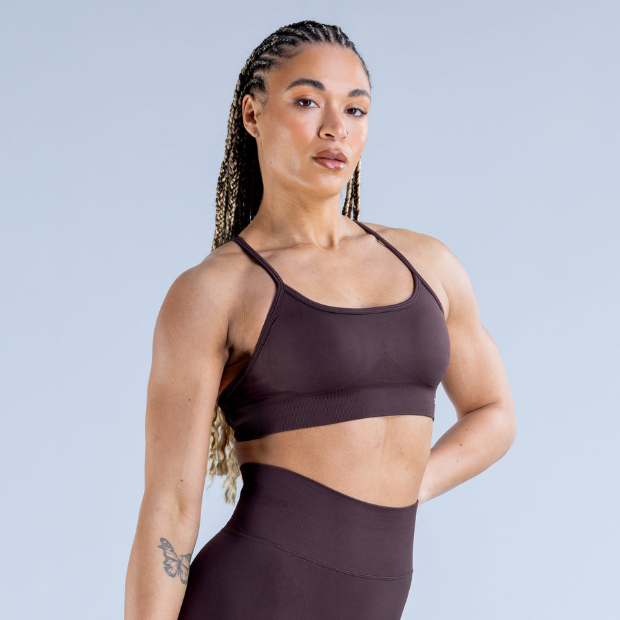 Dark plum backless sports bra with crisscross open back straps