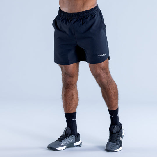 Dark navy training shorts with elastic waistband and side seams