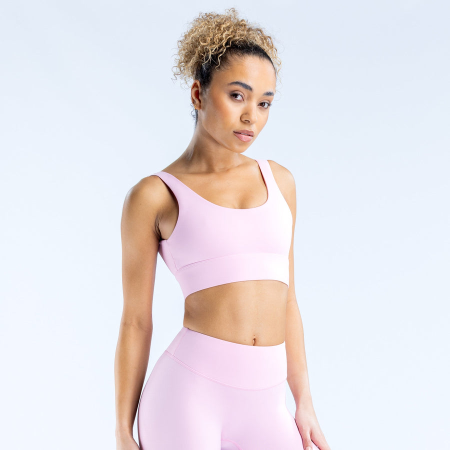 Lavender/pink scoop-neck sports bra with wide straps and supportive mid band