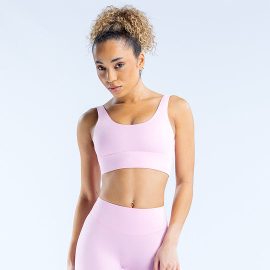 Lavender/pink sports bra with wide straps and smooth racerback design