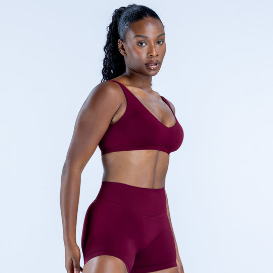 Burgundy scoop-neck sports bra, front view
