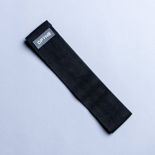 Black resistance band with small rectangular logo label