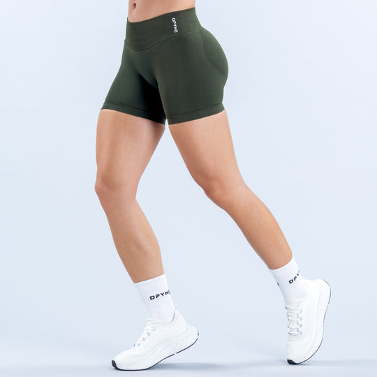 Dark green 4.5-inch fitted shorts with a high waistband, shown from the front and side.