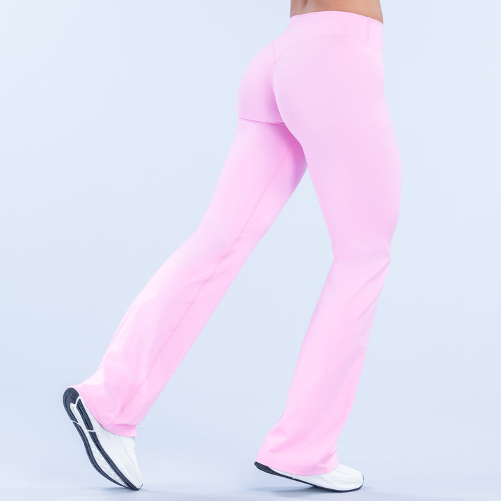 Light pink flared pants, back view showing smooth fit and wide leg opening