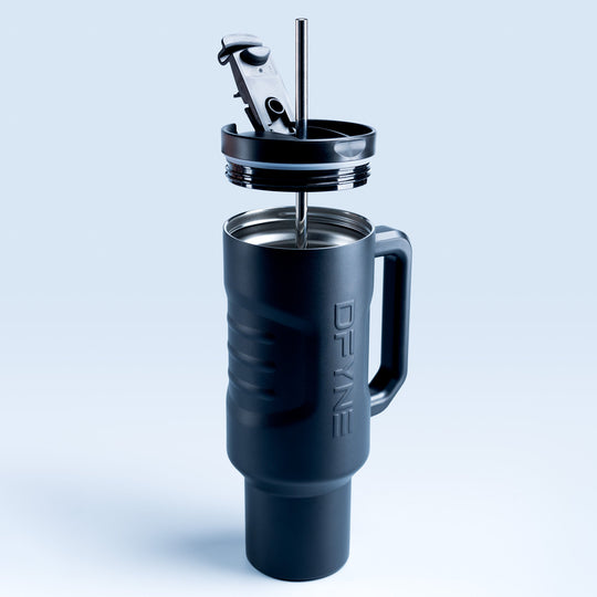 Insulated black drink tumbler with lid, straw, and flip-top opening