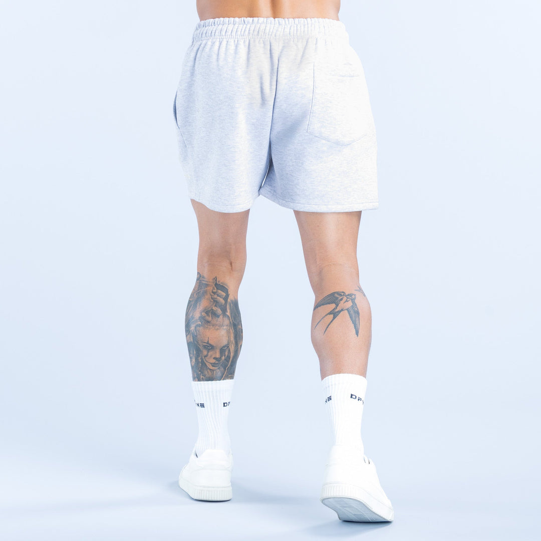 Light heather blue shorts with elastic waistband, above-knee cut, back view
