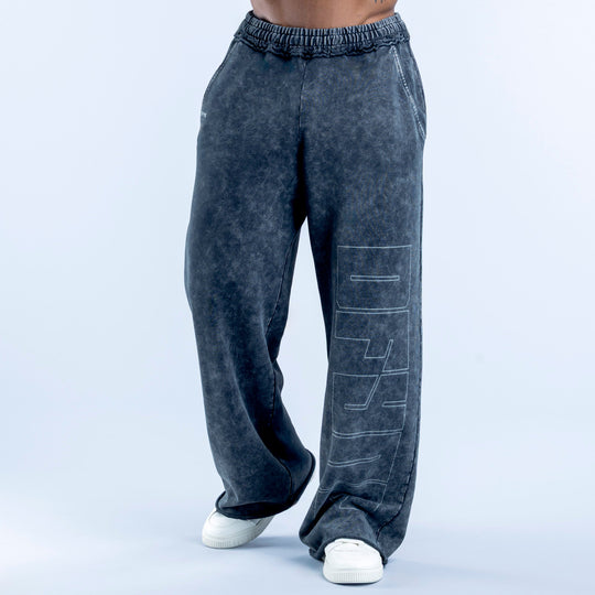 Washed jogger pants in dark navy with elastic waistband and graphic side print