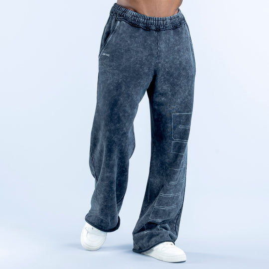 Washed jogger pants in dark navy with elastic waistband and side graphic panel