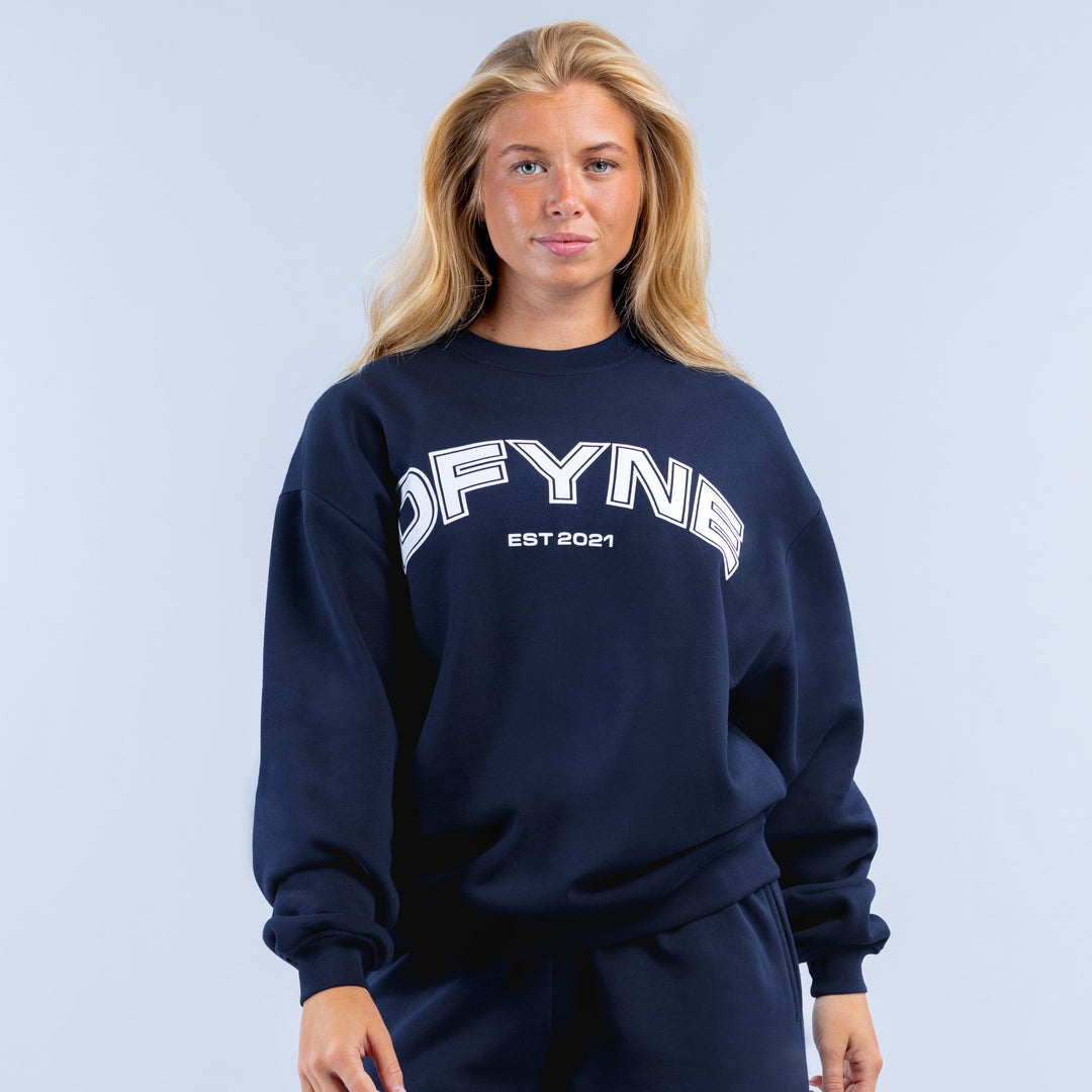 Navy crewneck graphic sweatshirt with DFYNE logo and EST 2021 print, ribbed cuffs
