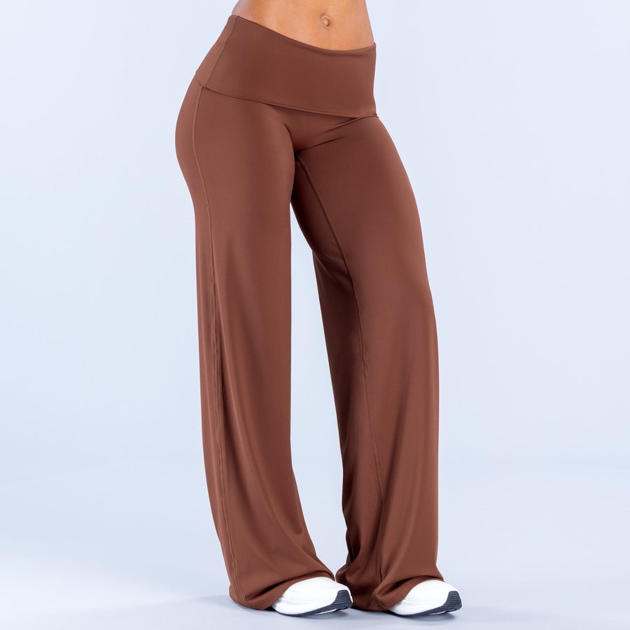 Rust fold-over wide-leg pants with clean seams and full-length straight drape