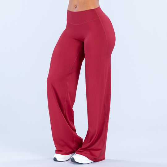 Red wide-leg pants, front three-quarter view, high waist and flowing wide legs