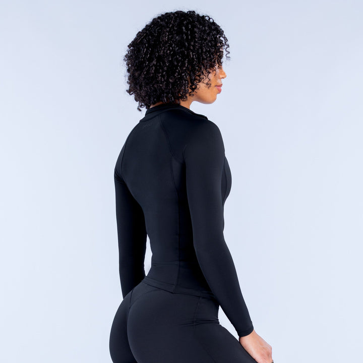 Black zip-front long-sleeve athletic jacket, side view