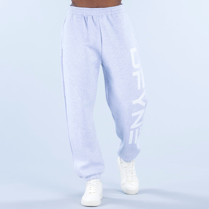 Light blue cuffed jogger pants with elastic waistband and side logo print