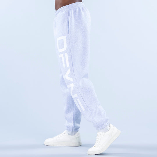 Light blue cuffed jogger pants with vertical side logo print and knit cuffs