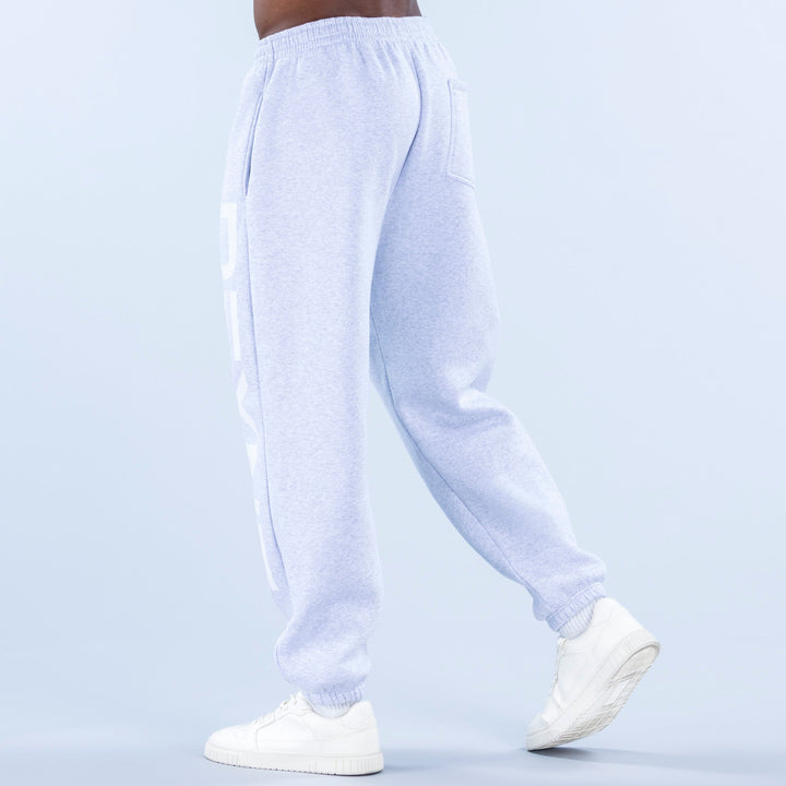 Light blue cuffed jogger pants with side logo graphic and tapered leg