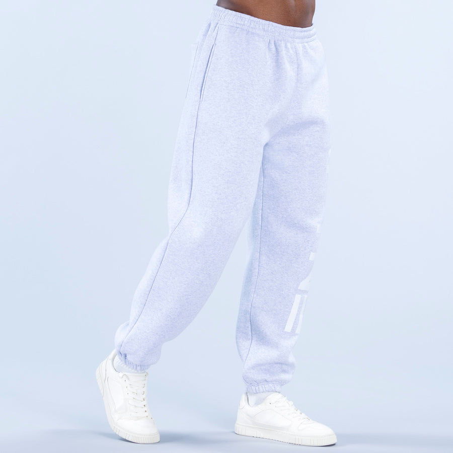 Light blue cuffed jogger pants with elastic cuffs and side logo detail