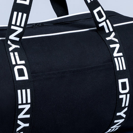 Black duffle bag with wide white logo webbing handles and top strap