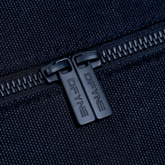 Black duffle bag zipper pulls with DYFINE logo