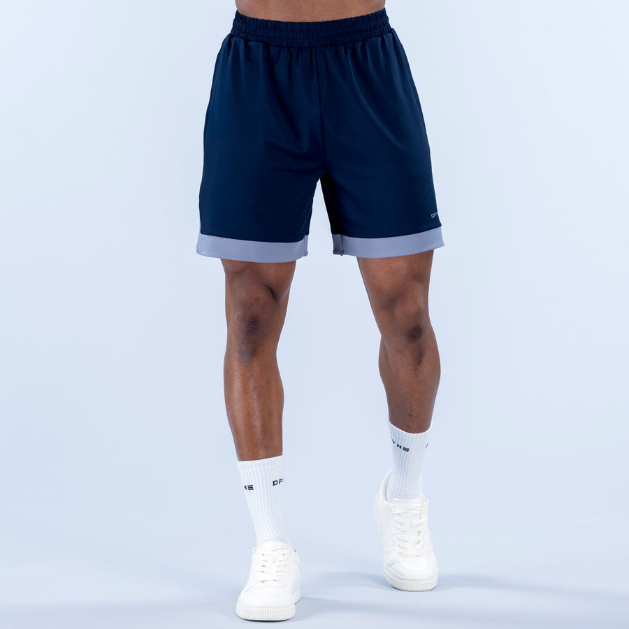 Navy jersey shorts with elastic waistband and light gray hem