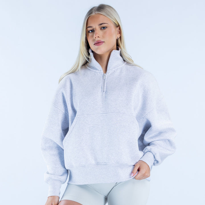 Light gray quarter-zip sweatshirt with zip neck and front pocket