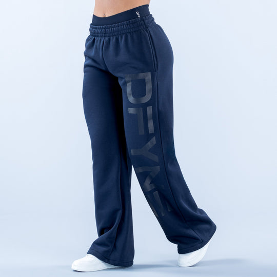 Dark navy wide-leg jogger pants with elastic waistband and drawstring, side pockets