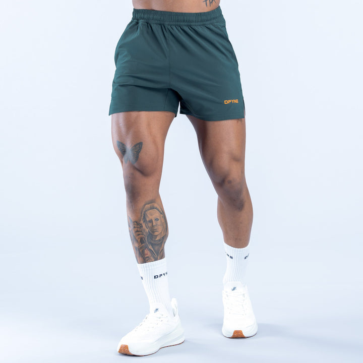 Men's teal training shorts, elastic waist, side pockets
