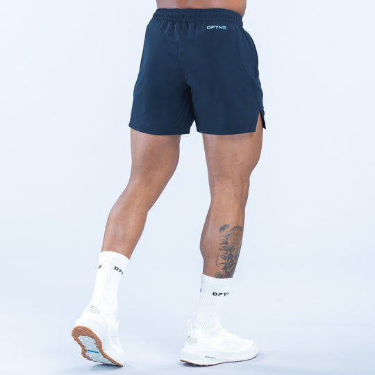 Navy training shorts with elastic waistband and side pocket detail