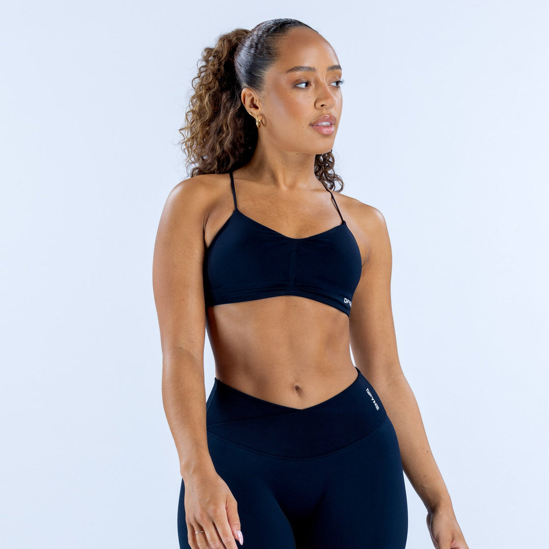 Navy strappy sports bra with racerback, scoop neckline and logo trim